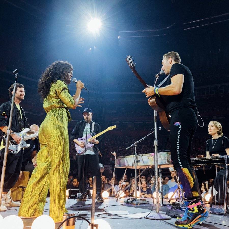 Kelly Rowland on stage with Coldplay's Chris Martin during Atlanta tour stop in June 2022.