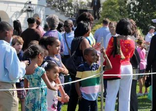 The Wait's Almost Over - Kids could hardly contain their excitement while waiting in line to get a crack at rolling their Easter eggs down the South Lawn. (Photo: Angel Elliott/ BET Digital)