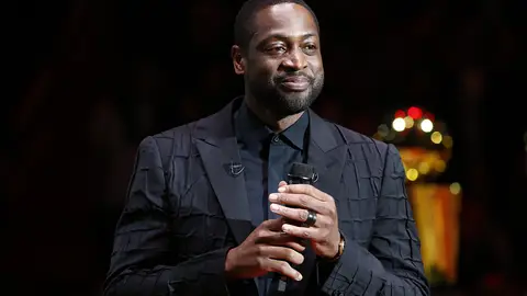 MIAMI, FLORIDA - FEBRUARY 22:  Former Miami Heat player Dwyane Wade addresses the crowd during his jersey retirement ceremony at American Airlines Arena on February 22, 2020 in Miami, Florida. NOTE TO USER: User expressly acknowledges and agrees that, by downloading and/or using this photograph, user is consenting to the terms and conditions of the Getty Images License Agreement.  (Photo by Michael Reaves/Getty Images)