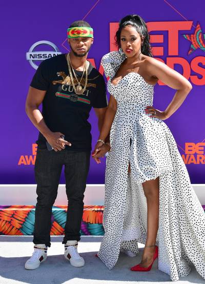 2018: Remy Ma and Papoose&nbsp; - First, can we take a moment to appreciate Remy Ma’s tiny waistline? I mean, right? Back in 2018, the Conceited rapper took the spotlight at the BET Awards in a custom Karensa Bag gown. Her husband, rapper Papoose, happily guided his wife down the carpet while wearing a Gucci headband, T-shirt, and fitted jeans.&nbsp; (Photo by Prince Williams/Getty Images)