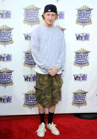 Asher Roth - Rapper Asher Roth rocked camouflage cargo shorts with a long-sleeve tee.&lt;br&gt;&lt;br&gt;(Photo Credit: PictureGroup)