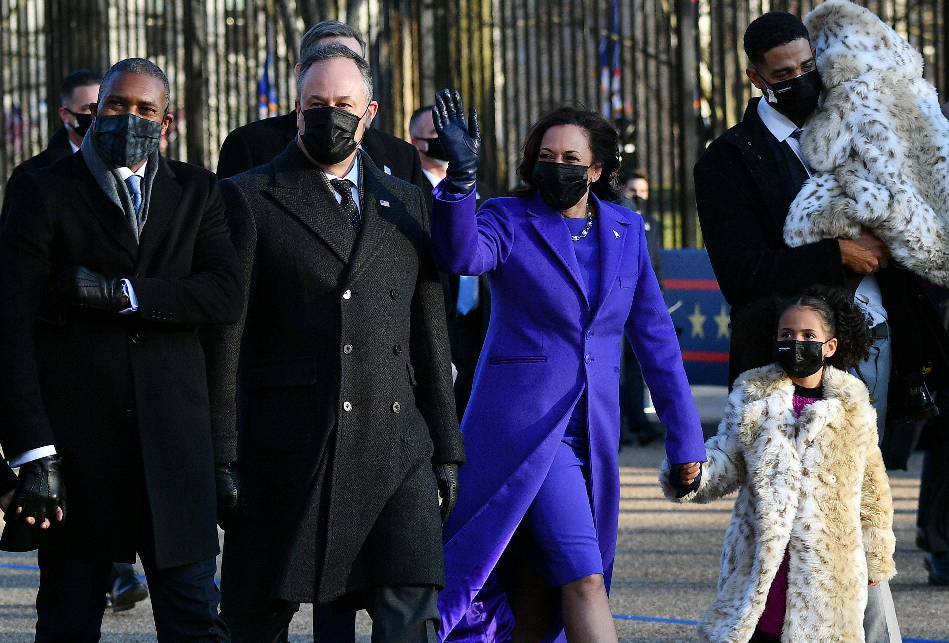 TOPSHOT - Vice President Kamala Harris and Second Gentleman Doug Emhoff along with family members walk along Pennsylvania Avenue to the White House in Washington, DC, after US President Joe Biden and Harris were sworn in, earlier on January 20, 2021. (Photo by MANDEL NGAN / AFP) (Photo by MANDEL NGAN/AFP via Getty Images)