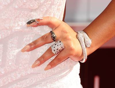 2014: Adrienne Bailon - Adrienne Bailon&nbsp;kept her nail art to a minimum at the 2014 BET Awards. Opting for simple nude nails, the singer and talk show host took her fresh mani to new levels with eye-popping jewelry. (Photo by Jason LaVeris/FilmMagic) (Photo by Jason LaVeris/FilmMagic)