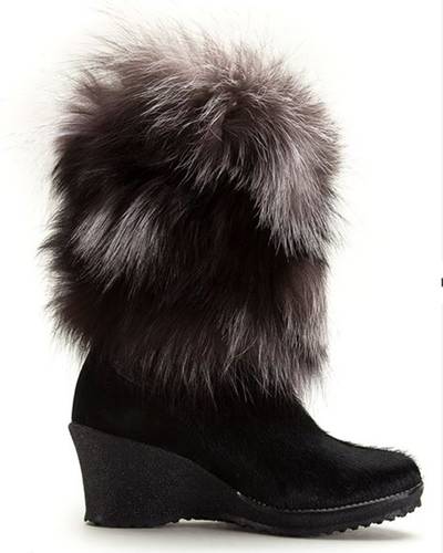 Tecnica 'Innsbruck' Boot - If glamour is your middle name, then we've got just the winter boot for you! From the deep suede outer shell to the chunky heel to the unapologetically fabulous fox fur, this designer pick will help you live up to your fashionable reputation in colder conditions.  (Photo: Far Fetch)