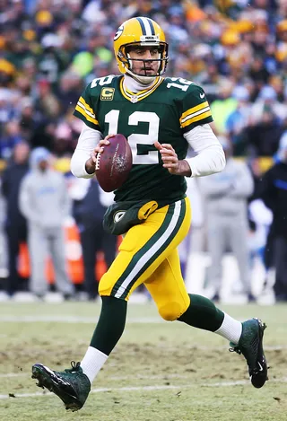 Packers Win NFC North Title - Aaron Rodgers threw for 226 yards and two touchdowns to lead the Green Bay Packers to a 30-20 home win over the Detroit Lions on Sunday. The win gave the Packers (12-4) their fourth straight NFC North division title and earns them a bye in the playoffs.&nbsp;(Photo: Chris Graythen/Getty Images)