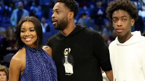 CHARLOTTE, NORTH CAROLINA - FEBRUARY 16: Dwyane Wade (C), wife Gabrielle Union-Wade (L) and son Zaire (R) look on during the MTN DEW 3-Point Contest as part of the 2019 NBA All-Star Weekend at Spectrum Center on February 16, 2019 in Charlotte, North Carolina. (Photo by Streeter Lecka/Getty Images)