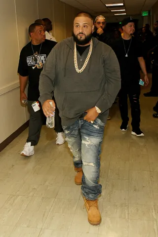 Still Out Here Grinding - Khaled walks in triumphant, letting the floor know he rocks his Tims with class.(Photo: Bennett Raglin/BET/Getty Images for BET Networks)