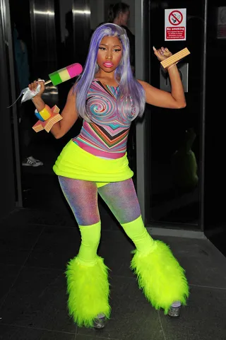 Wild Child - Nicki Minaj, in a flourescent psychedelic get-up, poses with her popsicle microphone and furry leg warmers as she leaves her London hotel.&nbsp;(Photo: PacificCoastNews.com)