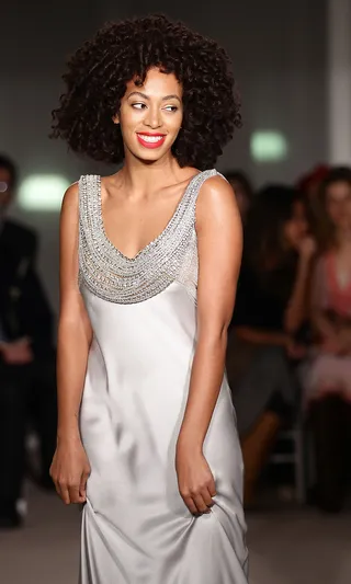 Do: Get Nude  - And we’re not talking about taking your clothes off! Nude dress hues can make for subtle elegance. Add a bright lip like Solange's for a burst of color.  (Photo: Vittorio Zunino Celotto/Getty Images)