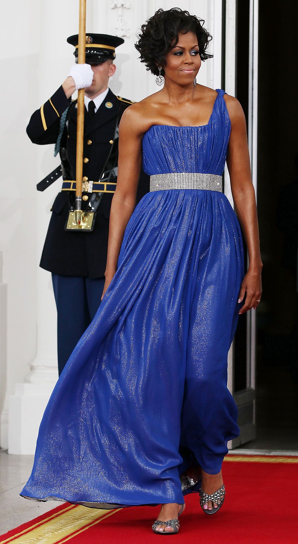 Bold in Blue - Michelle Obama walks with her husband to greet Mexican President Felipe Calderon and his wife, Margarita Zavala, for a state dinner at the White House on May 19, 2010, in Washington, D.C.&nbsp; (Photo: Mark Wilson/Getty Images)