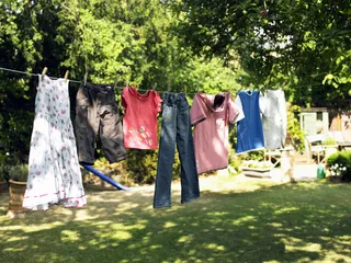 Air Dry Laundry - Keep energy costs and emissions down by hanging your laundry to dry in the sun rather than tossing them into the dryer.  (Photo: Courtesy GettyImages)