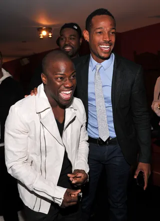 Guys Like Us - Comedians Kevin Hart and Marlon Wayans share a hearty laugh backstage at the BET Upfront event in New York City. (Photo: Leon/PictureGroup)