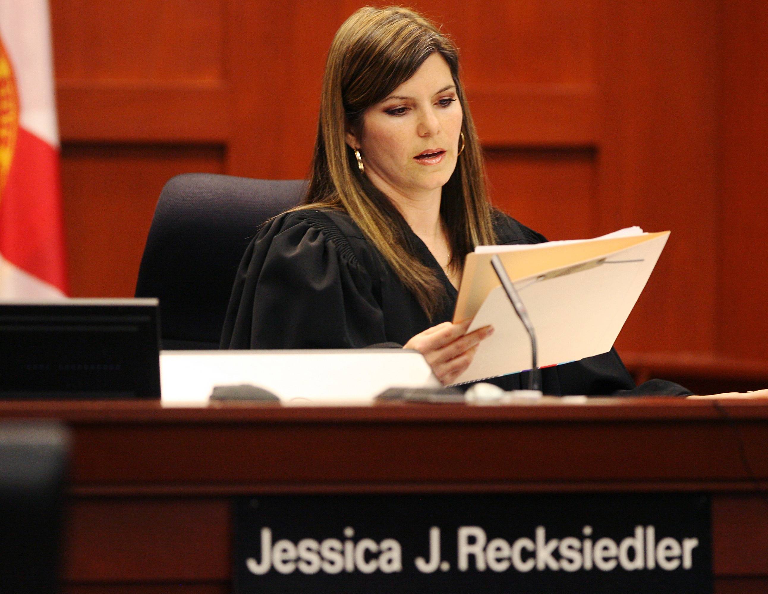 Judge Jessica Recksiedler - Judge Jessica Recksiedler recused herself from the case on April 18, citing a possible a conflict of interest. Just days before, Mark O’Mara filed a petition to remove her because she is married to the law partner of Mark NeJame, who had been approached by Zimmerman's family to him. NeJame is now a CNN legal analyst on the case.&nbsp;(Photo: Tom Benitez/The Orlando Sentinel-Pool/Getty Images)