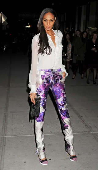 Joan Smalls - The model’s ruffled button-up paired with her purple Parabal Gurung satin pants and two-toned heels made for an ultra feminine look.  (Photo: Demis Maryannakis, PacificCoastNews.com)