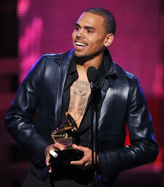 First Grammy Award - The numbers don’t lie.&nbsp;Breezy's&nbsp;F.A.M.E. also produced his second-best sales week. The critically acclaimed album was a win for the fans, but after eight Grammy Award nominations, the album finally made Chris a Grammy winner. F.A.M.E. won the 2012 Grammy Award for Best R&amp;B Album.(Photo: Kevin Winter/Getty Images)