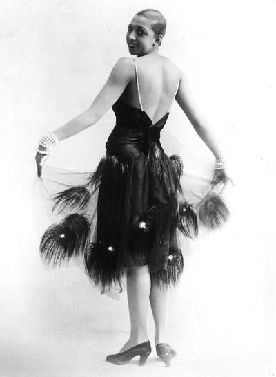 Josephine Baker - In the 1920s, Josephine Baker left the prudish United States for the European stage where she became known for her barely-there ensembles, banana skirts, funky accessories and gelled-back hair.   (Photo: General Photographic Agency/Getty Images)