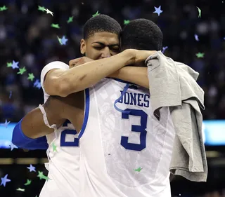 Emotional Win - Kentucky forward Anthony Davis hugs forward Terrence Jones after the hard won victory.&nbsp; (Photo: AP Photo/David J. Phillip)
