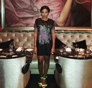 Flower Child - Angela Simmons took to Instagram and posted this fab photo. She styled in a Topshop flower-print leather-like dress that she teamed with neon sandals.  (Photo: Instagram via Angela Simmons)
