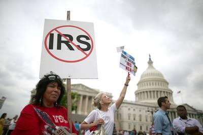 IRS Targets Tea Party Groups - In May, news broke that the Internal Revenue Service had&nbsp;targeted conservative organizations with the words &quot;tea party&quot; or &quot;patriot&quot; in their names seeking tax-exempt status. Obama called the action &quot;outrageous&quot; and several agency officials were forced to step down.  &nbsp;(Photo: Mark Wilson/Getty Images)