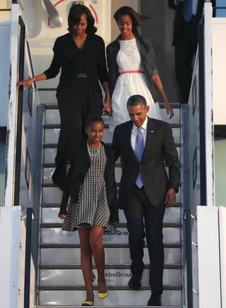 The First Family Has Landed - Daughters Sasha and Malia joined President Obama and First Lady Michelle on their trip to Berlin on June 18. The first family donned formal looks as they descended Air Force One.  (Photo: Sean Gallup/Getty Images)