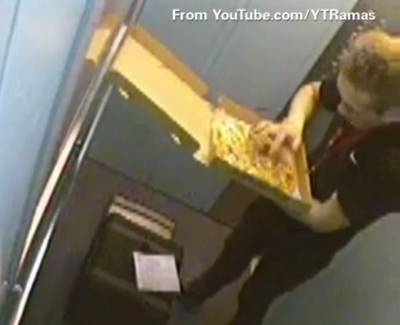 Slim Pickings - A Russian pizza delivery man literally took his share of the pie by digging into a customer's pizza with his hands and eating toppings while on a delivery run. The unsightly incident was caught by cameras inside an elevator and hit the Internet in May. (Photo: YTRamas via Youtube)