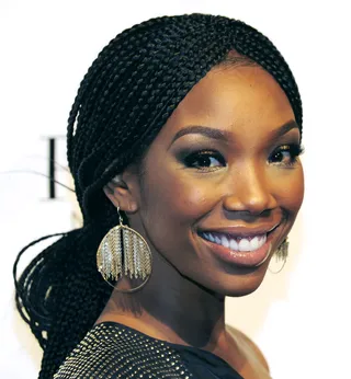 Throwback Brandy - The singer returns to her roots with center-parted braids styled in a chic chignon for her brother Ray J’s 30th birthday bash.  (Photo: Steven Lawton/FilmMagic)