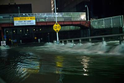 Markets Reopen - The New York Stock Exchange and Nasdaq opened on two days later. The closing marked the first time since 1888 that the NYSE remained closed for two consecutive days due to weather, writes the AP.In this image, water rushes into the Carey Tunnel (formerly the Brooklyn Battery Tunnel) in New York's Financial District.(Photo: Andrew Burton/Getty Images)