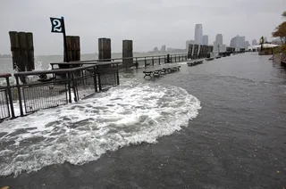 High Seas - Waves wash over the seawall near high tide at Battery Park in New York Monday. (Photo:&nbsp; AP Photo/Craig Ruttle)