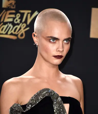 Cara Delevingne - Model Cara Delevingne surprises fans with a blonde buzz cut at the 2017 MTV Movie and TV Awards.(Photo: Alberto E. Rodriguez/Getty Images)