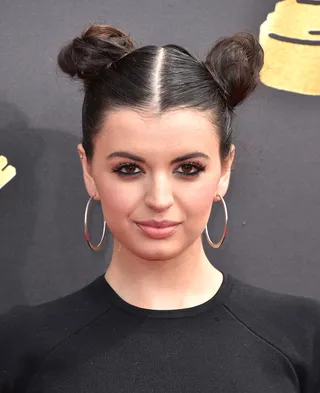 Rebecca Black - Singer Rebecca Black attends the 2017 MTV Movie and TV Awards with a two-bun hair style. She's giving us super retro.&nbsp;(Photo: Alberto E. Rodriguez/Getty Images)
