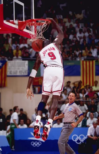 Slam! - Michael Jordan perfects his dunking technique during the basketball finals during the Olympic Games in Barcelona. (Photo: Mike Powell/Allsport)