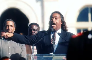 Million Man March - Rev. Al Sharpton speaks to the crowd while a member of the Nation of Islam stands guard at the Million Man March October 16, 1995, in Washington, D.C. The purpose of the march was to galvanize men to respect themselves and others spiritually, morally, mentally, socially, politically and economically. (Photo:&nbsp; Porter Gifford/Liaison)