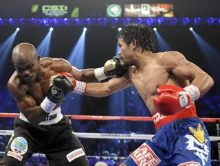 Not Pulling Punches - Bradley and Pacquiao trade blows.&nbsp;(Photo: AP Photo/Chris Carlson)