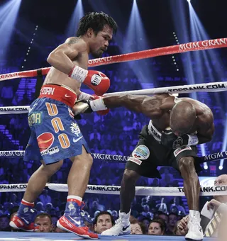 On the Ropes - Pacquiao pummels Bradley.&nbsp;(Photo: AP Photo/Julie Jacobson)
