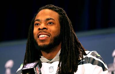 Throwing Rocks at Richard Sherman's Throne - Richard Sherman is a big believer in the phrase ‘numbers don’t lie.’ In May, he tweeted a statistical graphic that showed him crushing head-to-head competition against fellow cornerbacks Patrick Peterson, Joe Haden and Darrelle Revis in the 2013 season. Sherman ranked first across nearly every category including least targeted, least amount of touchdowns and passing yards allowed and most interceptions (eight). Quite simply, Sherman backed up all his talk and left little doubt that he is the NFL’s best cornerback. Well, with that title comes a lot of his fellow corners throwing rocks at his throne. This past weekend, New York Jets corner Dee Milliner declared himself the best CB in football. You listening to this, Rich? BET.com points out all of the cornerbacks trying to corner the market and dethrone Sherman. (Photo: Elsa/Getty Images)