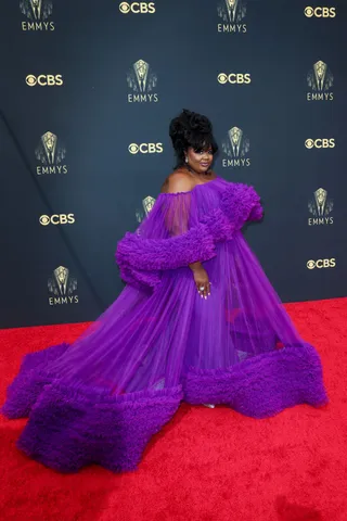 Nicole Byer&nbsp; - Nicole Byer glows in a purple Christian Siriano dress. The voluminous sheer look flowed beautifully across the red carpet.&nbsp; (Photo: Getty Images)