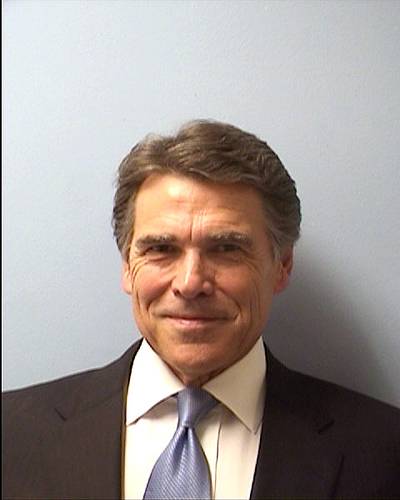 What a Mug! - Texas Gov. Rick Perry posed for this mugshot after&nbsp; turning himself in to authorities at the Blackwell-Thurman Criminal Justice Center on Aug. 19. He was indicted last Friday on felony charges of abuse of power and coercion of a public servant, which both Rebublicans and Democrats have declared bogus. (Photo: Travis County Sheriff’s Office via Getty Images)