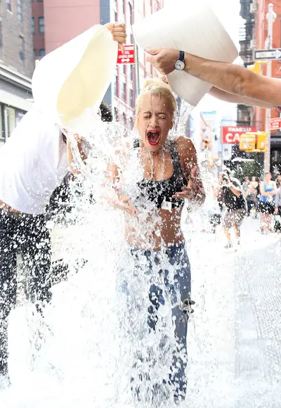 Take the Challenge - Rita Ora&nbsp;in NYC gets drenched while doing the ALS Ice Bucket Challenge, which is to raise awareness and funds for amyotrophic lateral sclerosis also known as Lou Gehrig's disease.(Photo: Splash News)
