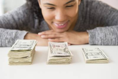 081814-b-real-achievement-gaining-financial-freedom-woman-money-budget-savings.jpg