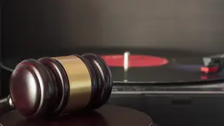 Judge's gavel and vinyl record player. Concept of entertainment lawsuit, music piracy and copyright protection (Judge's gavel and vinyl record player. Concept of entertainment lawsuit, music piracy and copyright protection, ASCII, 112 components, 112