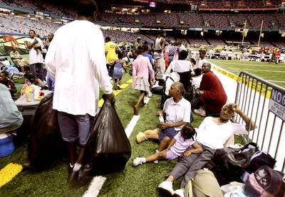 Shelters Fill Up Before the Storm - The Superdome was used as an emergency shelter, before the arrival of Hurricane Katrina in New Orleans. Katrina killed at least seven when it moved through Miami-Dade County in Florida.&nbsp;(Photo: Mario Tama/Getty Images)
