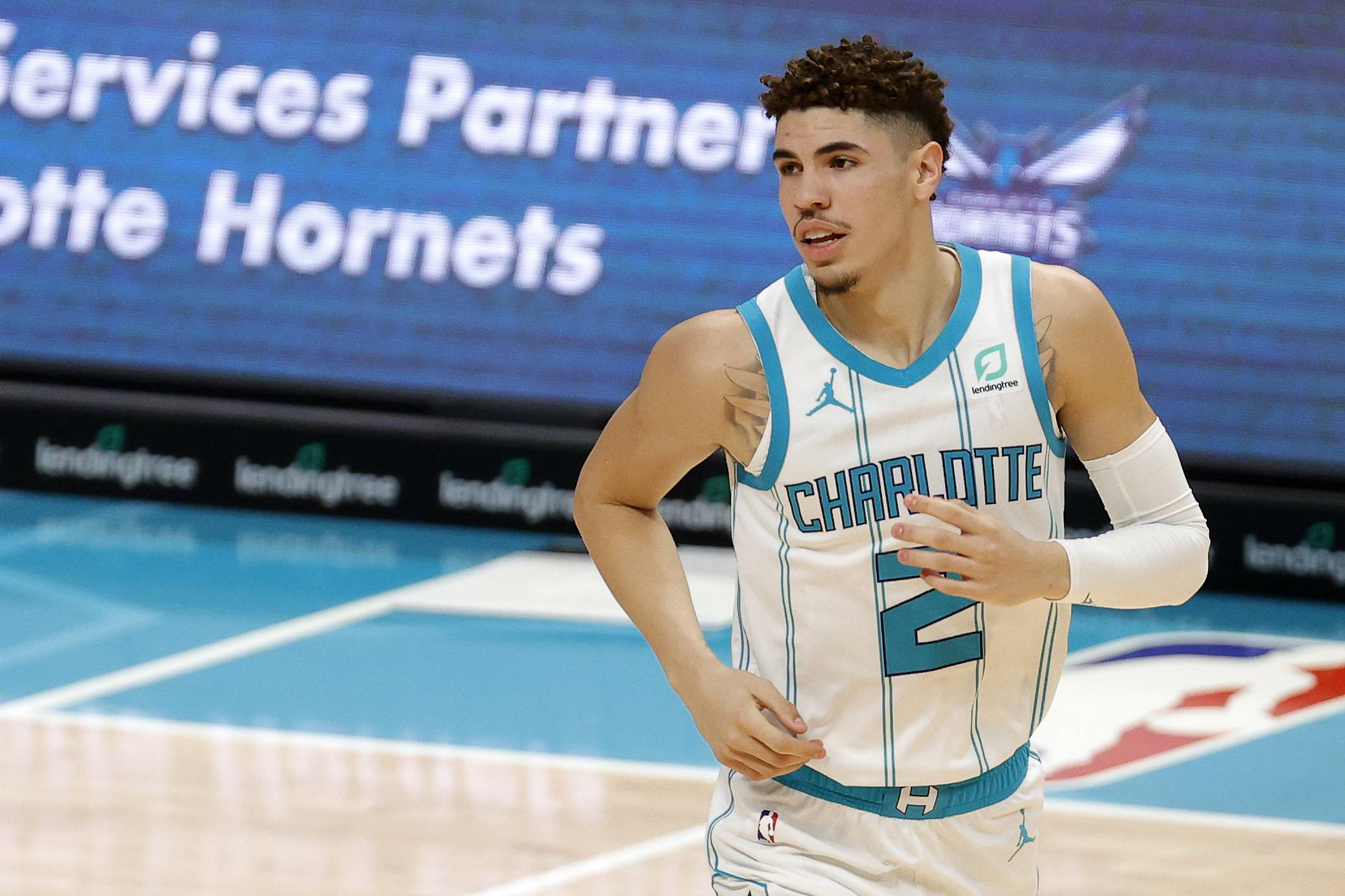 CHARLOTTE, NORTH CAROLINA - DECEMBER 12: LaMelo Ball #2 of the Charlotte Hornets looks on during the first half of their game at Spectrum Center on December 12, 2020 in Charlotte, North Carolina. (Photo by Jared C. Tilton/Getty Images)