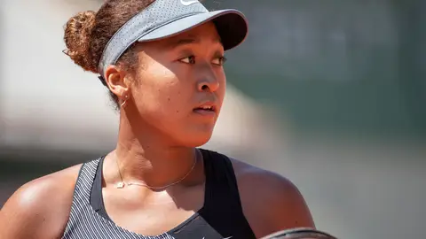 PARIS, FRANCE May 30.  Naomi Osaka of Japan during her match against Patricia Maria Tig of Romania in the first round of the Women's Singles competition on Court Philippe-Chatrier at the 2021 French Open Tennis Tournament at Roland Garros on May 30th 2021 in Paris, France. (Photo by Tim Clayton/Corbis via Getty Images)