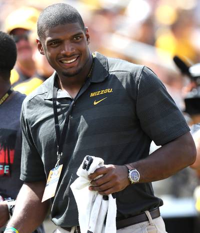 Michael Sam - The football player made waves when he became the first openly gay NFL prospect in history, but really made waves when he celebrated his draft to the St. Louis Rams by sharing a sweet kiss with his boyfriend...on ESPN in May, 2014. Many gave Sam props for breaking the last taboo in professional sports, but a vocal minority took issue with the couple's open display of affection. Either way, everybody was talking about it. (Photo: Ed Zurga/Getty Images)