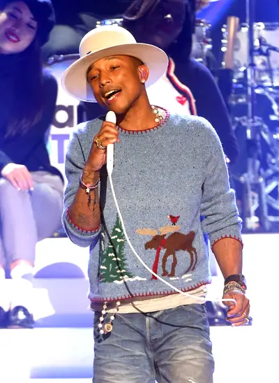 Holiday Happy - Pharrell Williams performs on stage during A Very Grammy Christmas at the Shrine Auditorium in Los Angeles.(Photo: Frederick M. Brown/Getty Images)