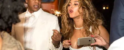 The Sparkle of Love - Jay Z&nbsp;and Beyoncé&nbsp;enjoy the fireworks during the second-line parade following baby sister Solange's wedding to her music-video director beau, Alan Ferguson, in New Orleans.(Photo: Josh Brasted/WireImage)