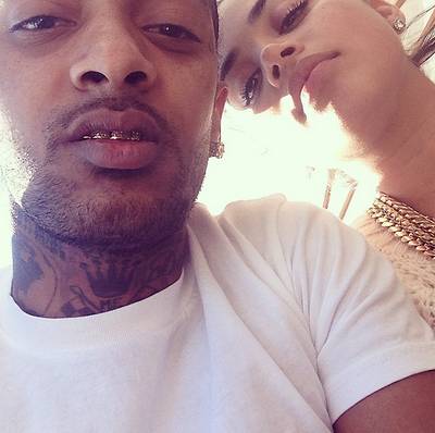 Nipsey Hussle, @nipseyhussle - Lovebirds Nipsey Hussle and Lauren London keep a low profile, but in this rare &quot;usie,&quot; they show off their love and grillz in the cutest way possible.  (Photo: Nipsey Hussle via Instagram)