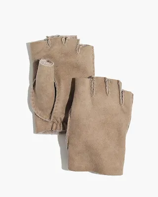 Owen Barry Fingerless Gloves - You’ll be able to text and tweet to your heart’s delight with these fingerless gloves. A luxurious shearling lining gives this particular pair an extra dose of coziness. (Photo: Madewell)