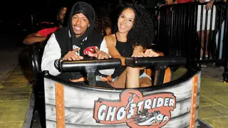 Actor Nick Cannon and Brittany Bell ride 'Ghostrider' at Knott's Berry Farm on September 1, 2017 in Buena Park, California.