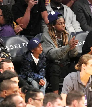 Father and Son - Lil Wayne&nbsp;took his son to the Los Angeles Lakers game to see them defeat the Brooklyn Nets at the Staples Center.&nbsp;(Photo: WENN.com)